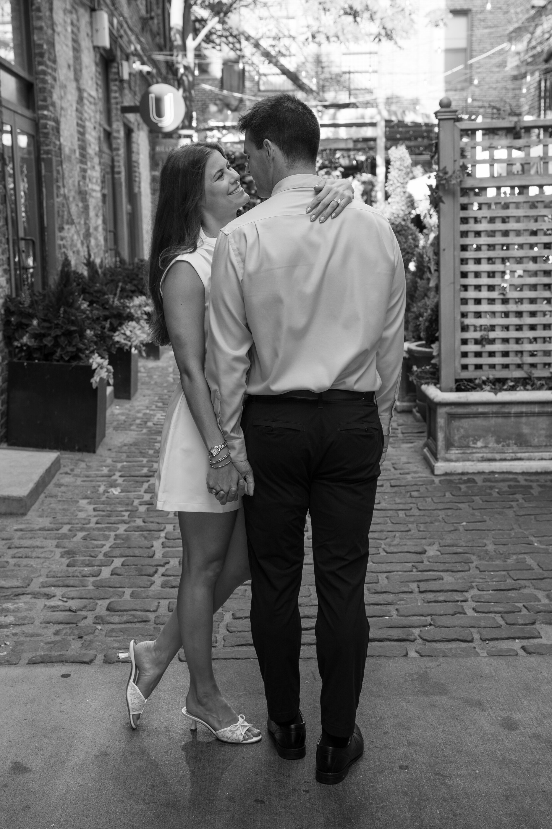 Tom and Anna in a quiet alleyway