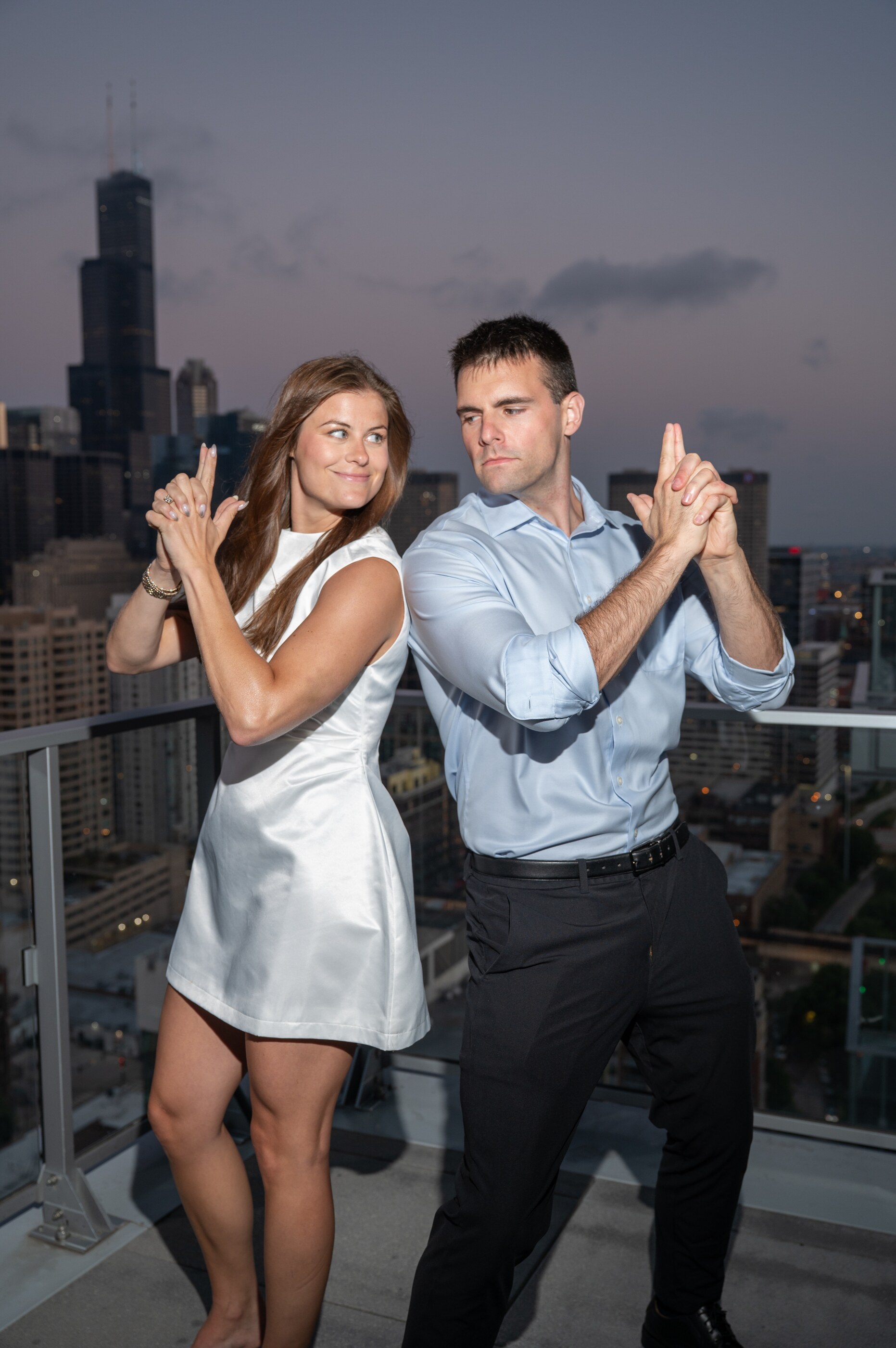 Tom and Anna on a rooftop overlooking Chicago