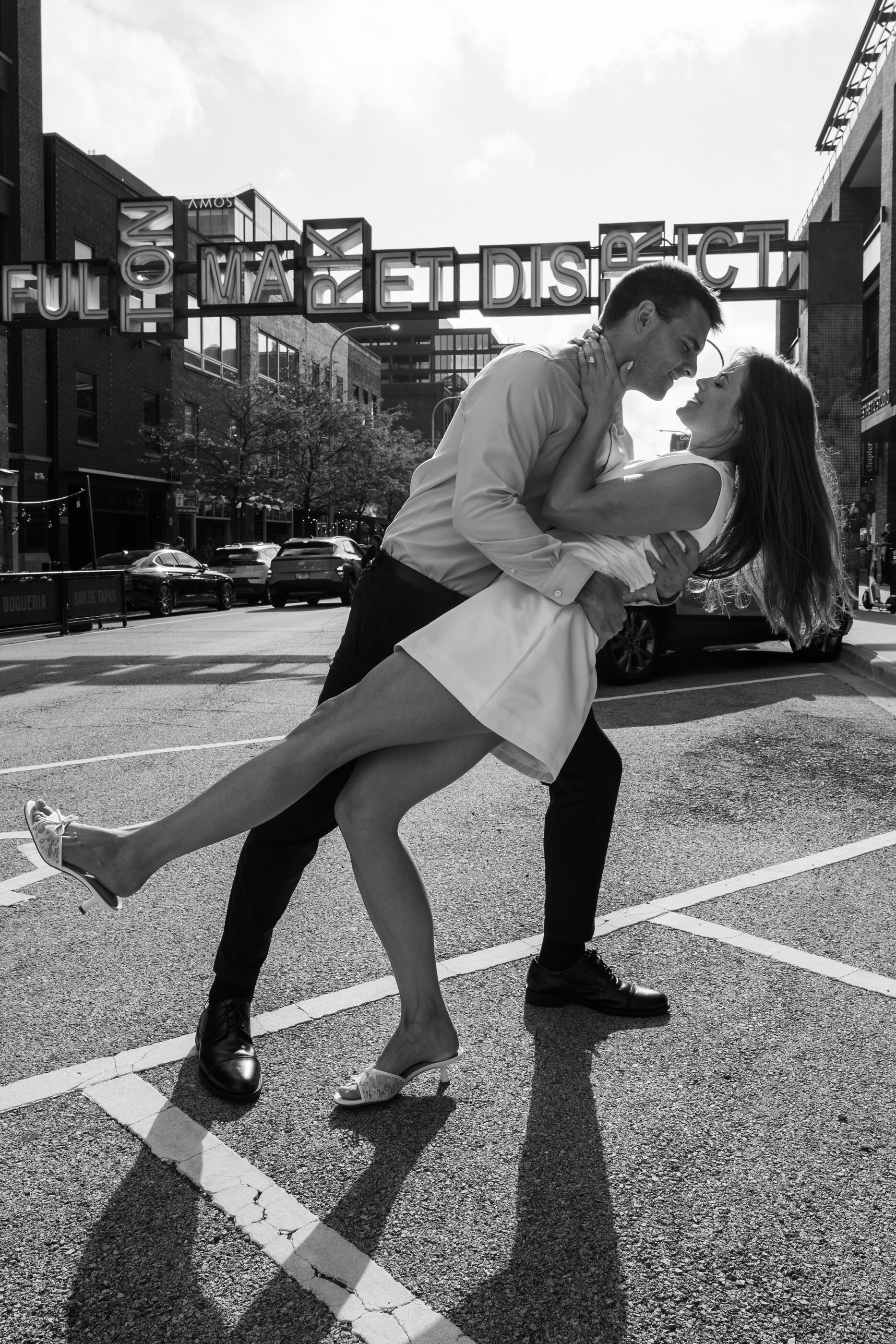 Tom and Anna embracing on a street in Chicago
